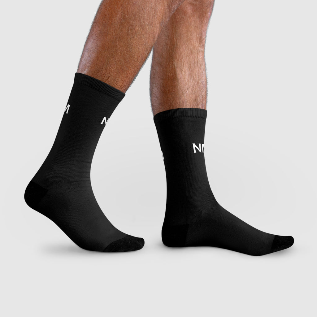 person wearing Black socks with branding
