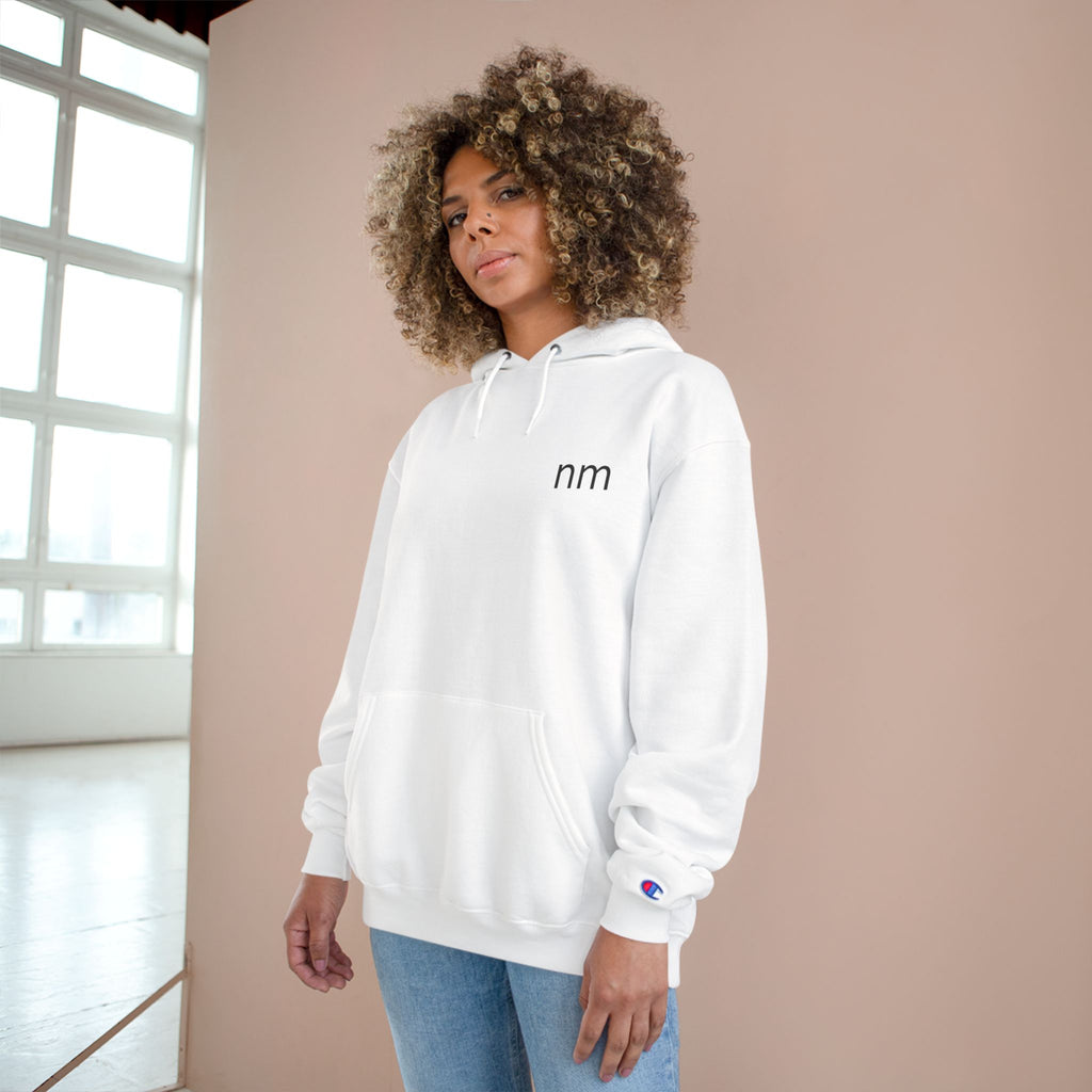 Person wearing a white hoodie with a brand logo 