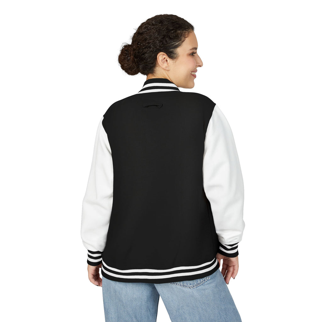 Back view of a person wearing Black and white varsity jacket 