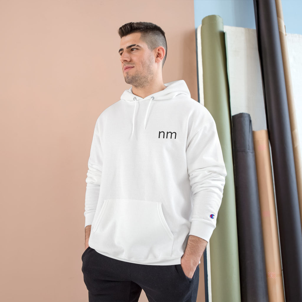 Man wearing a white hoodie with 'nm' logo